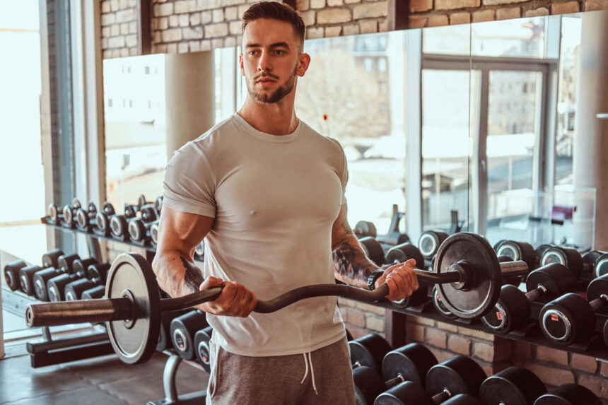 how long does it take to build muscle | man in gym | bicep curl