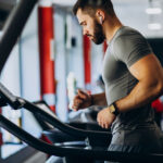 Man performing a LISS workout on a treadmill | LISS vs. HIIT cardio