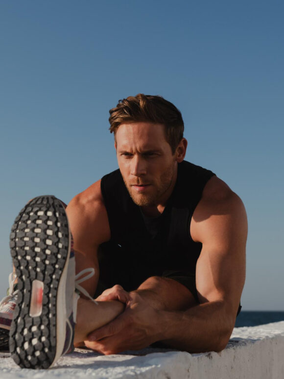 how to set workout goals | man stretching