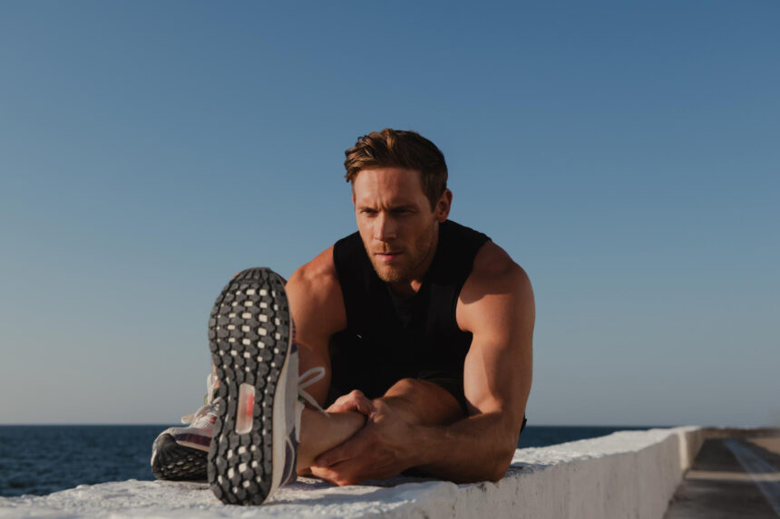 how to set workout goals | man stretching