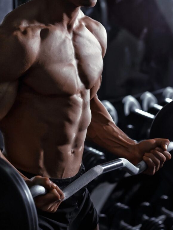 concentric_eccentric_and_isometric_contractions Concentric, Eccentric, and Isometric Contractions | man in gym biceps curl