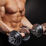 drop sets | man performing biceps curls